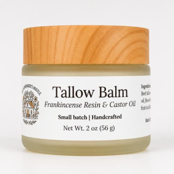 A frosted jar with a wood grain lid and white label containing frankincense resin and castor oil tallow balm