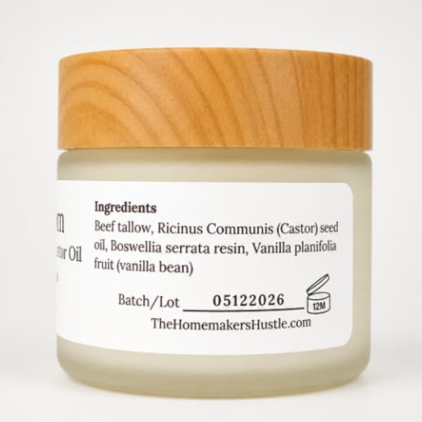 Ingredient view of a frosted jar with a wood grain lid and white label containing frankincense resin and castor oil tallow balm